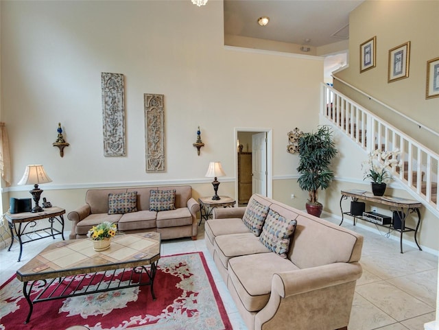 living room featuring a high ceiling