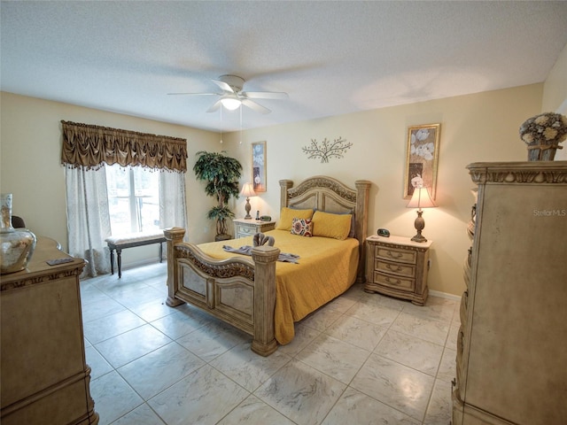 bedroom featuring a textured ceiling and ceiling fan