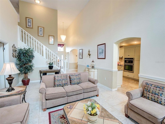 living room featuring high vaulted ceiling