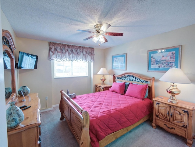 bedroom with carpet floors, a textured ceiling, and ceiling fan