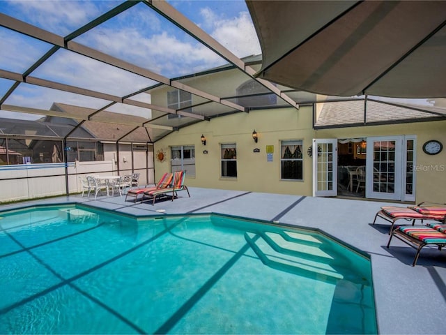 view of pool with a lanai and a patio