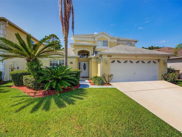 view of front of house featuring a garage and a front yard