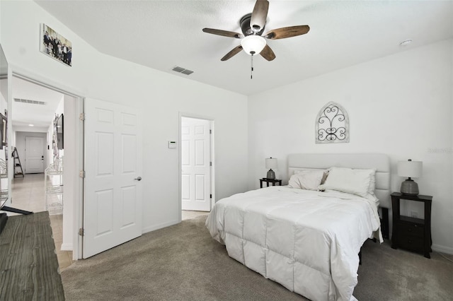 carpeted bedroom with ceiling fan