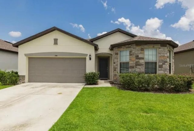 794 Citrus Isle Dr, Davenport, FL 33837 - single story home featuring stucco siding, a front yard, stone siding, an attached garage, and concrete driveway
