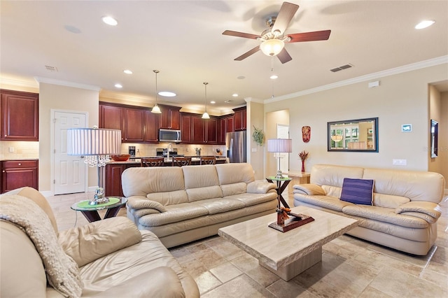 living room with ceiling fan and crown molding