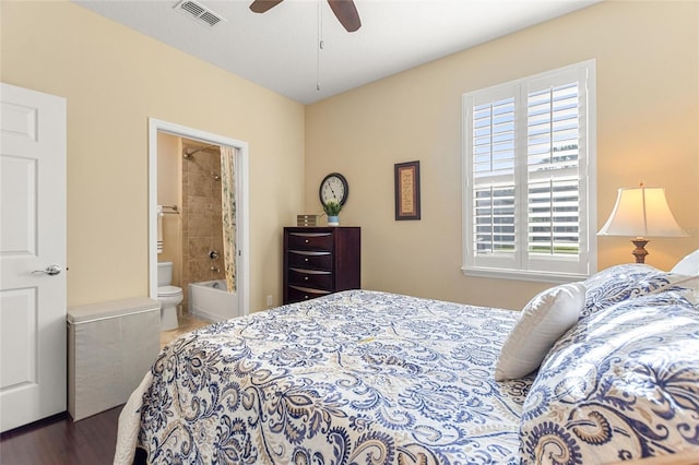 bedroom with wood-type flooring, ceiling fan, and ensuite bathroom