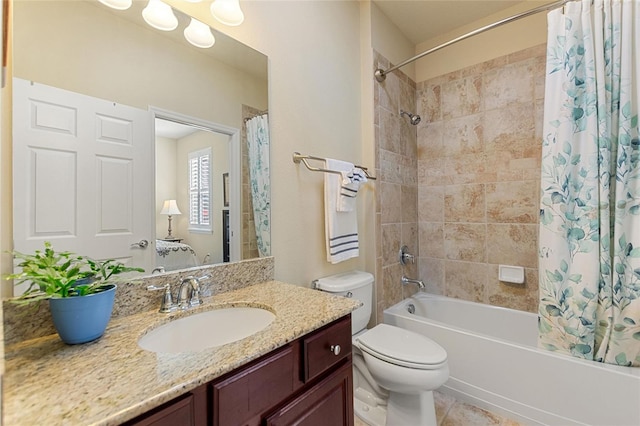 full bathroom featuring tile patterned flooring, vanity, toilet, and shower / bath combo with shower curtain