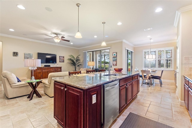 341 Navarra Ln, Davenport, FL 33837 - kitchen with dishwasher, a sink, stone tile flooring, open floor plan, and reddish brown cabinets