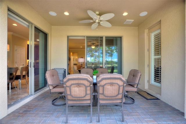 341 Navarra Ln, Davenport, FL 33837 - view of patio with outdoor dining area, visible vents, and a ceiling fan