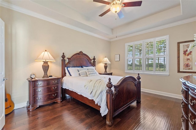 341 Navarra Ln, Davenport, FL 33837 - bedroom with dark wood-type flooring, baseboards, a raised ceiling, and ceiling fan