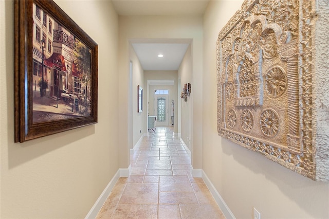 341 Navarra Ln, Davenport, FL 33837 - corridor with stone tile flooring, baseboards, and recessed lighting