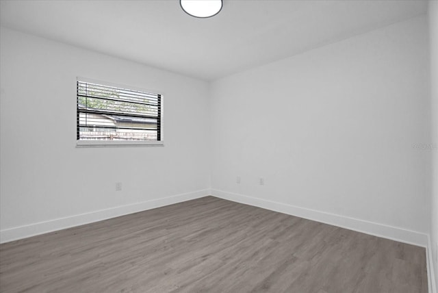 unfurnished room featuring hardwood / wood-style flooring