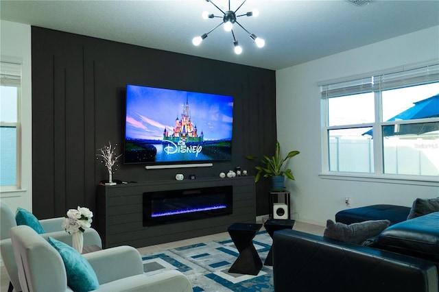 cinema room with an inviting chandelier