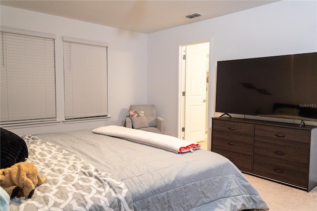 bedroom with light carpet