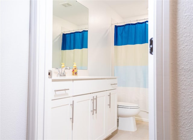 bathroom featuring a shower with shower curtain, tile patterned flooring, vanity, and toilet