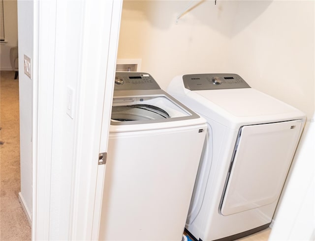 laundry room with washer and clothes dryer