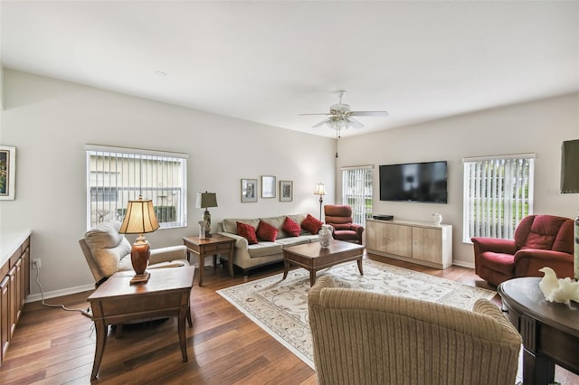 living room with hardwood / wood-style flooring, a healthy amount of sunlight, and ceiling fan