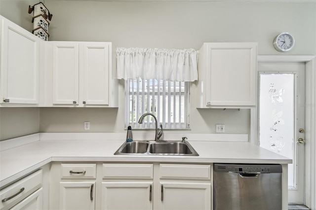 kitchen featuring white cabinetry, dishwasher, and sink