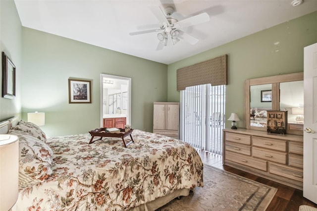 bedroom with ceiling fan, ensuite bath, and dark hardwood / wood-style floors