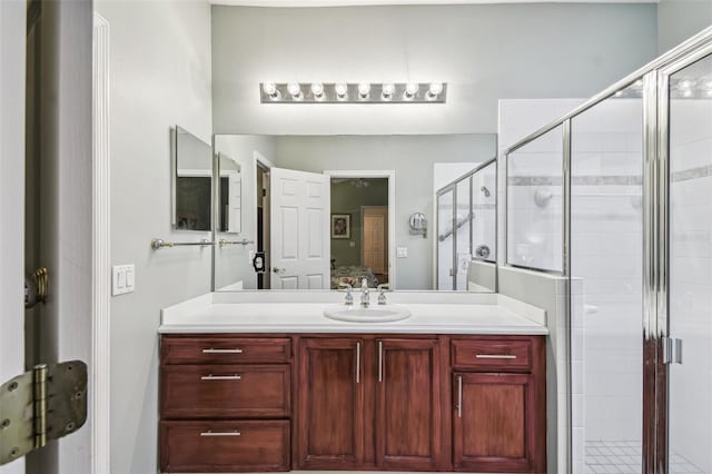 bathroom with vanity and an enclosed shower