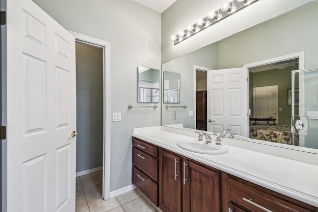 bathroom with vanity, tile patterned floors, and walk in shower