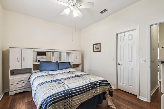 bedroom featuring ceiling fan and dark hardwood / wood-style floors