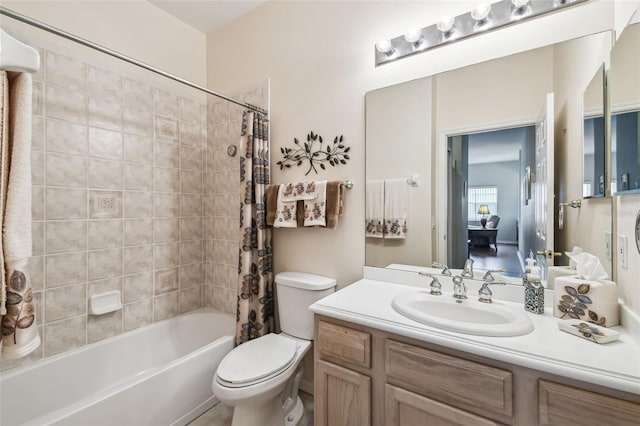 full bathroom with vanity, shower / bath combo, and toilet