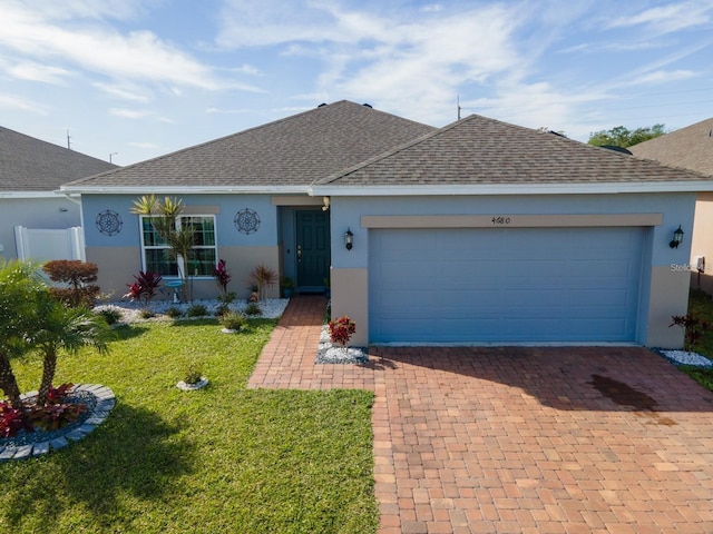 ranch-style house featuring a garage and a front yard