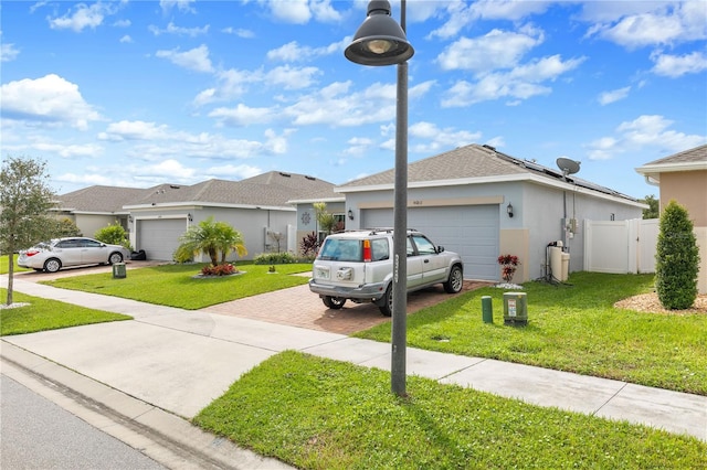 view of front facade with a front yard and a garage