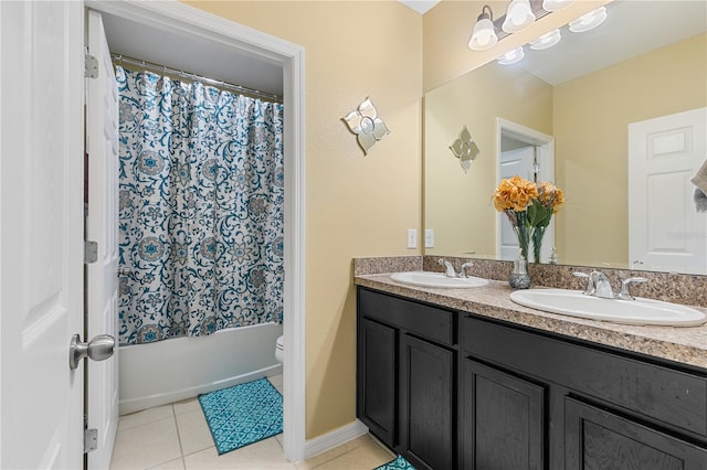 full bathroom with shower / tub combo, tile patterned flooring, vanity, and toilet