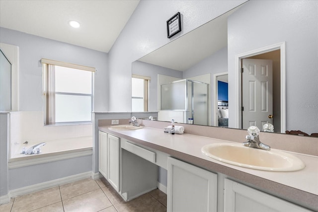 bathroom featuring lofted ceiling, vanity, plus walk in shower, and tile patterned floors