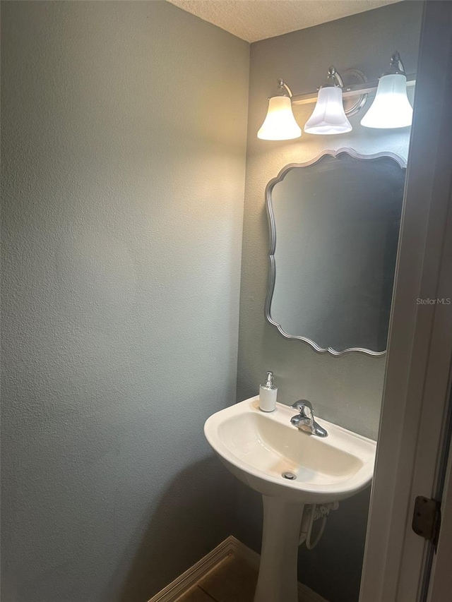 bathroom with a textured ceiling