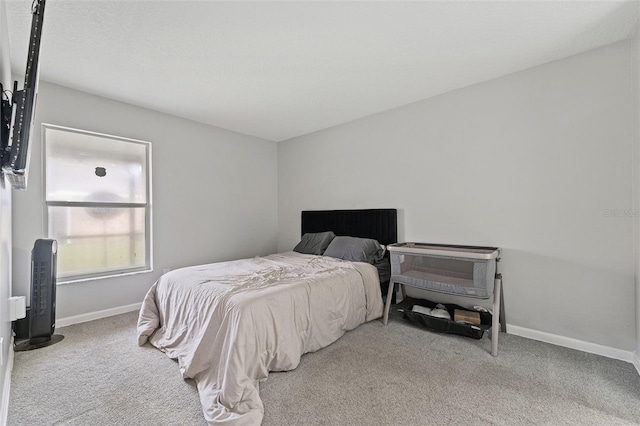 bedroom with light colored carpet