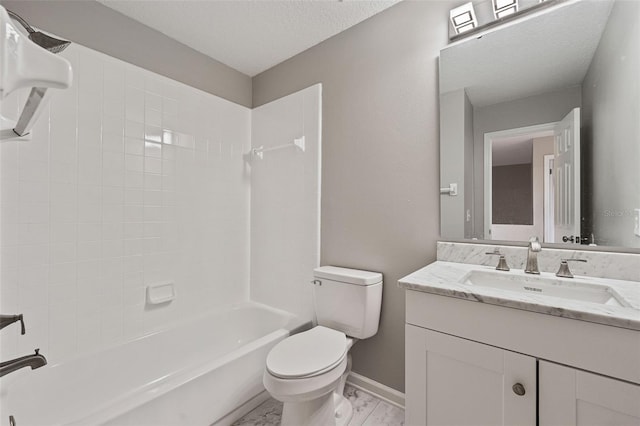 full bathroom featuring a textured ceiling, tiled shower / bath, vanity, and toilet