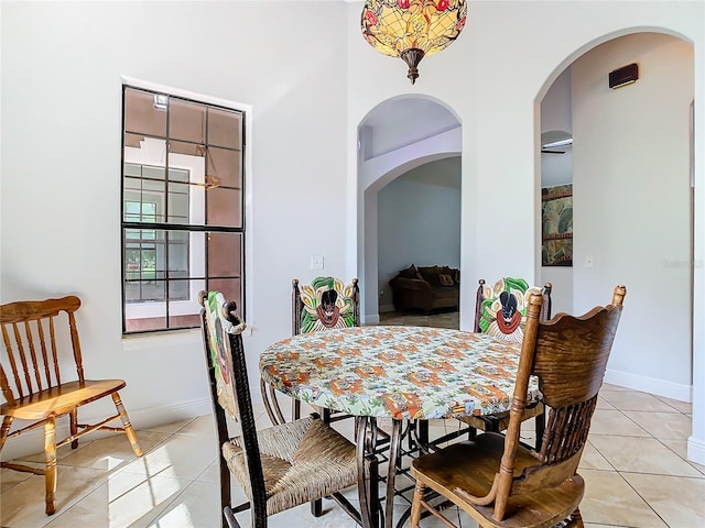 dining space with light tile patterned floors