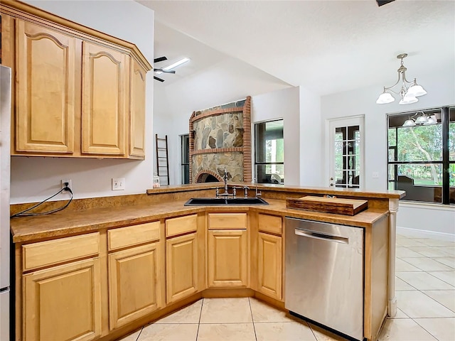 kitchen featuring kitchen peninsula, sink, a healthy amount of sunlight, and stainless steel dishwasher