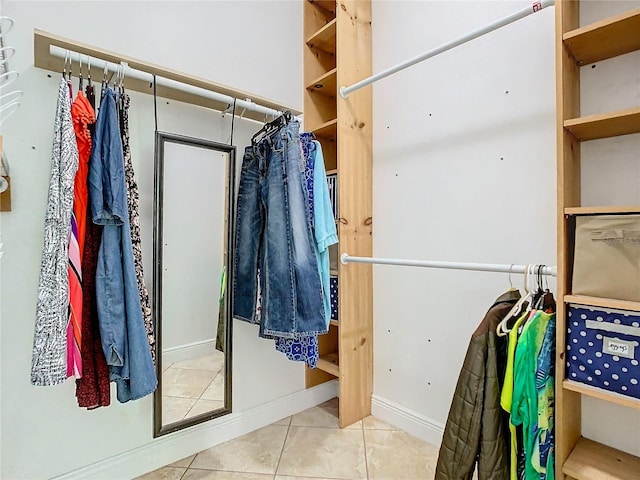 spacious closet with light tile patterned flooring