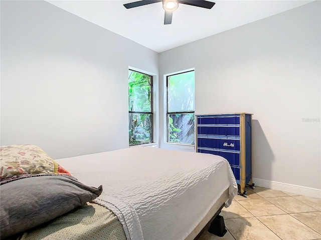 bedroom featuring ceiling fan and light tile patterned floors