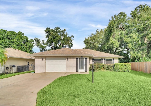 ranch-style home featuring a front yard and a garage