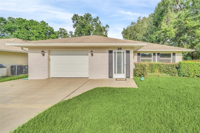 ranch-style home with a front yard and a garage