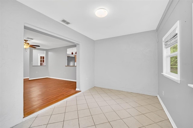 spare room with ceiling fan and light hardwood / wood-style floors