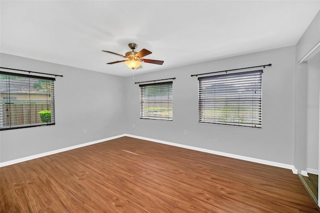 unfurnished room featuring ceiling fan and hardwood / wood-style flooring