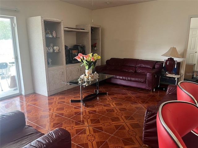 living room featuring dark tile patterned flooring