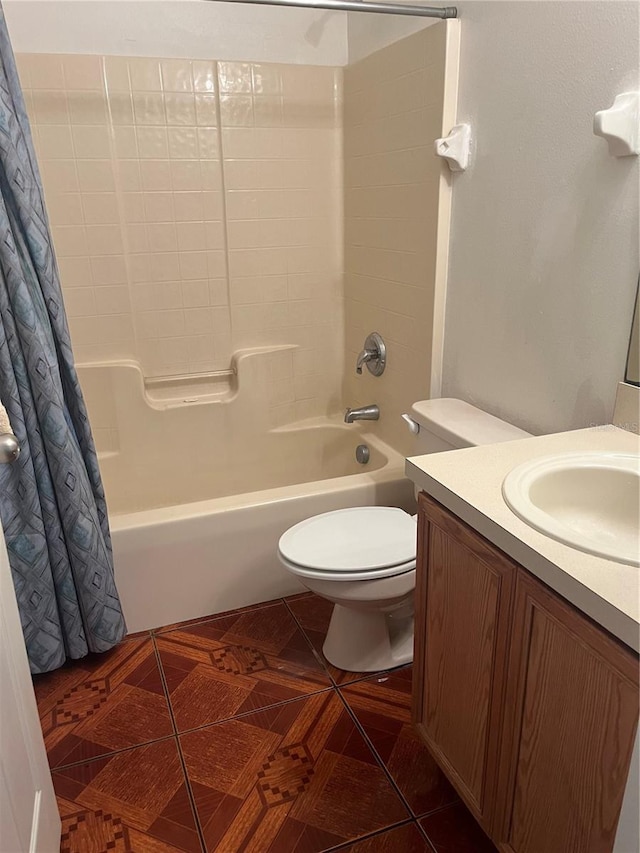 full bathroom featuring shower / tub combo, tile patterned flooring, vanity, and toilet