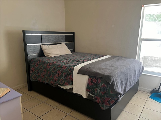 bedroom featuring light tile patterned flooring