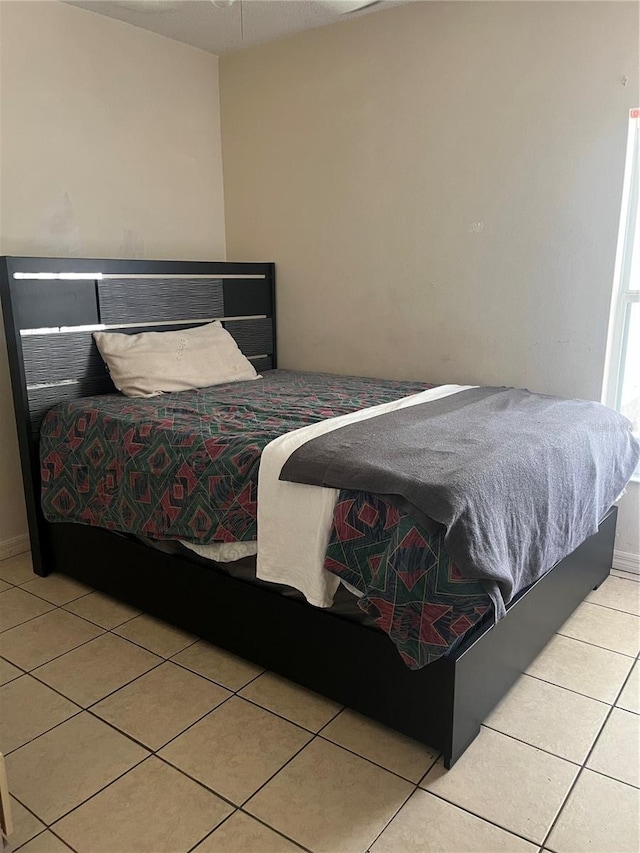 bedroom featuring light tile patterned floors