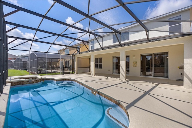 view of pool with glass enclosure, an in ground hot tub, and a patio area