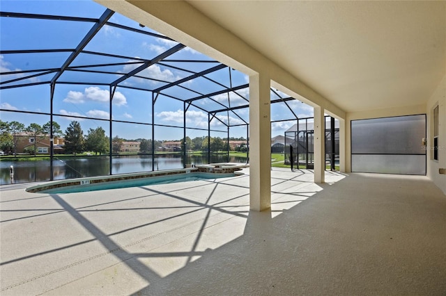 view of pool featuring a lanai, a patio, and a water view