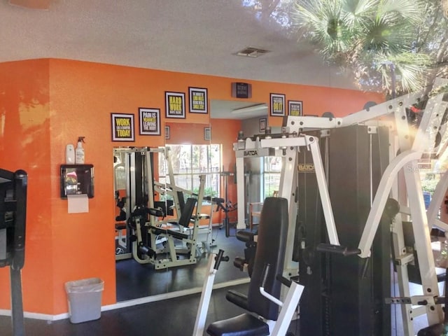 gym with a textured ceiling