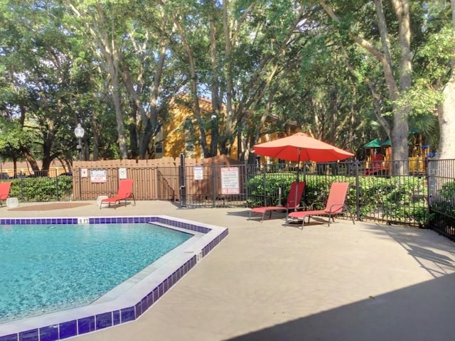 view of swimming pool featuring a patio